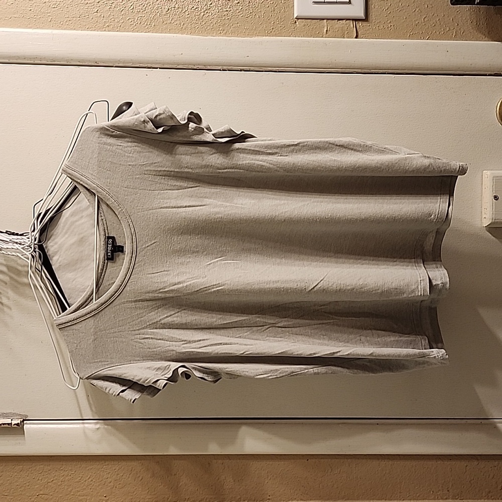 Express light gray top with ruffles on sleeves. Size XL.